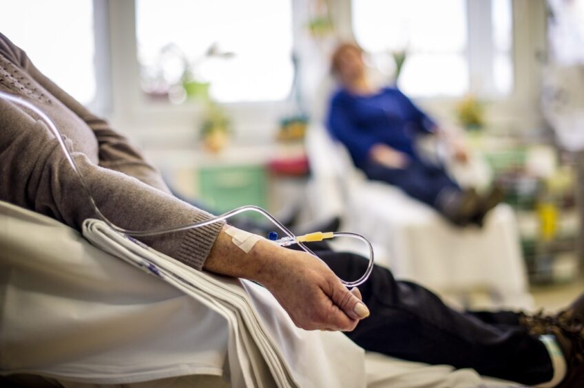 Stock image of patient receiving treatment in hospital.