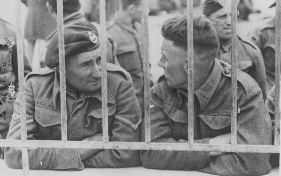British tank men in a temporary prison compound in Greece