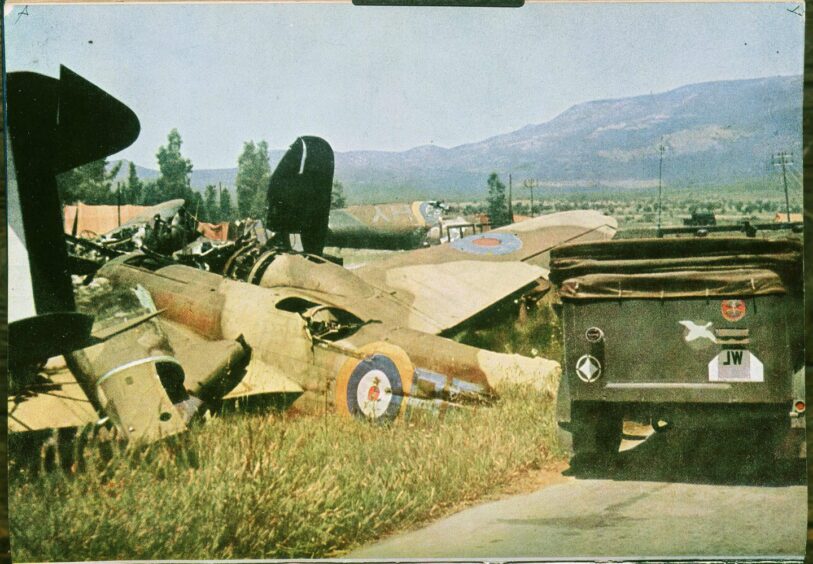Wrecked allied aircraft with German transport on Crete
