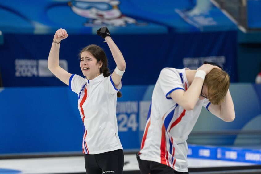 Callie Soutar and Ethan Brewster after claiming gold in the mixed doubles at the Winter Youth Olympics. 