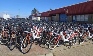 More than 100 ebikes are stacked up outside a unit in Altens after they were pulled from Aberdeen streets. Image: Lauren Taylor / DC Thomson