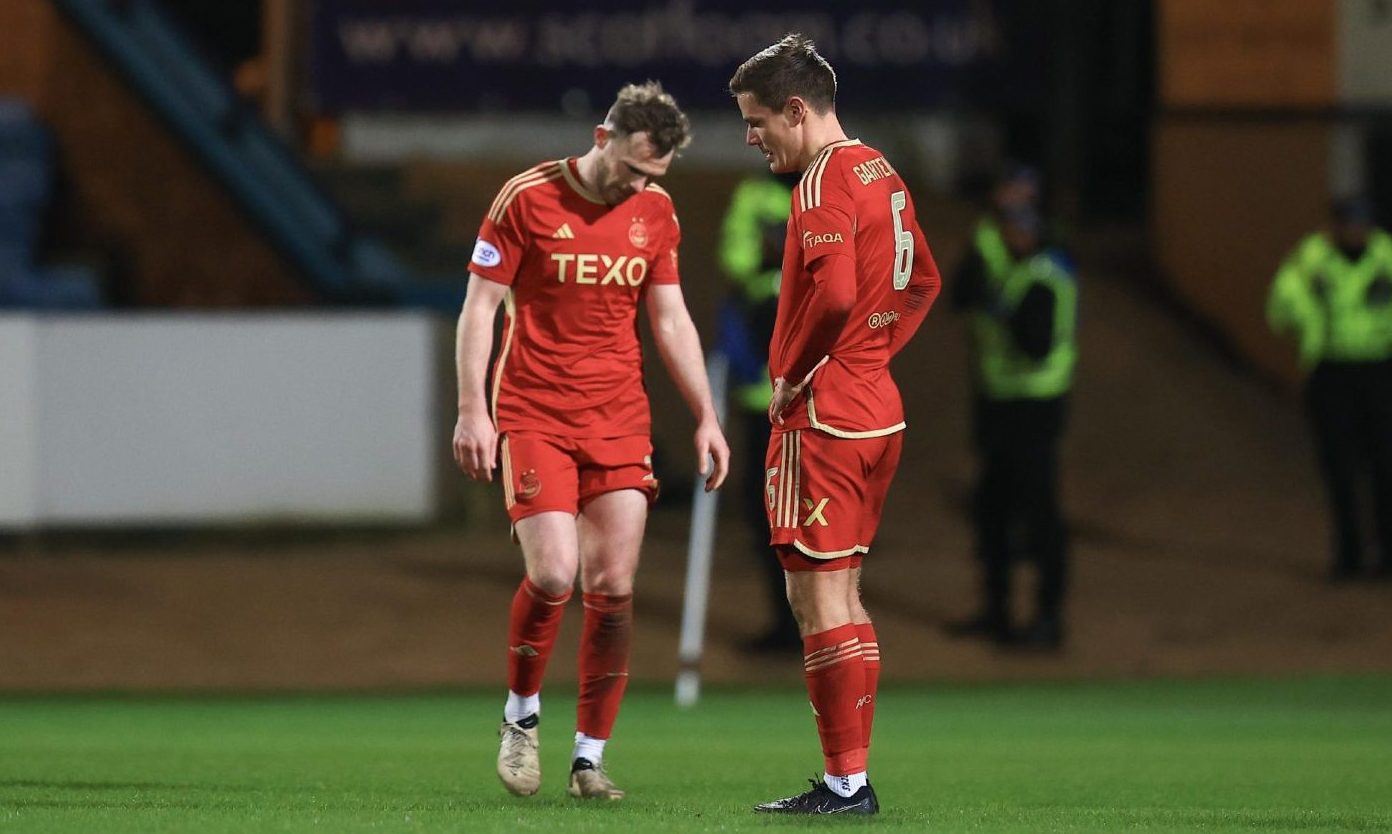 Stefan Gartenmann and Nicky Devlin of Aberdeen FC look dejected at the end of the 1-0 loss to Dundee. Image: Shutterstock
