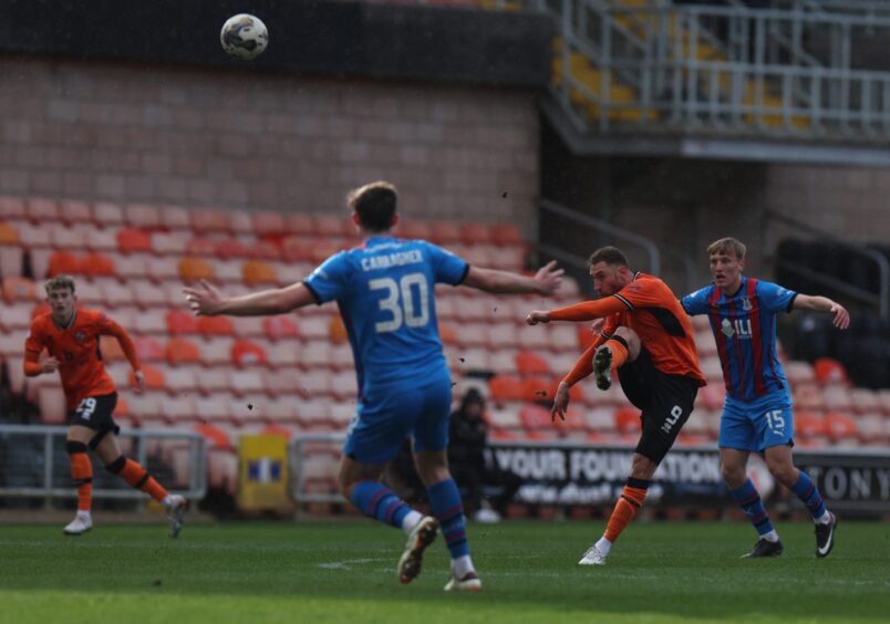 Dundee United's Louis Moult unleashes his strike from near the half-way line which levelled the score against Caley Thistle.