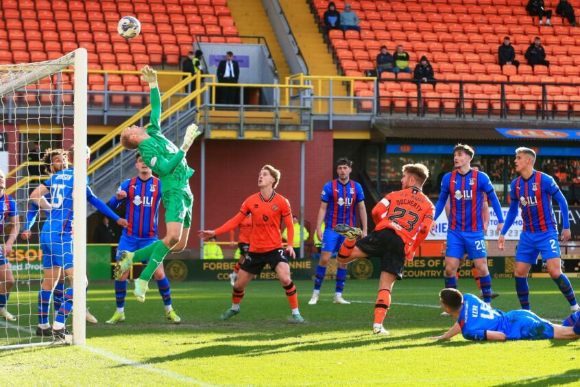 Caley Thistle goalkeeper Mark Ridgers makes a great save to deny Ross Docherty of Dundee United.