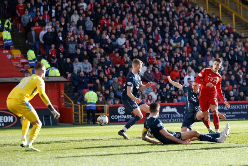 Jamie McGrath scores for Aberdeen against Ross County.