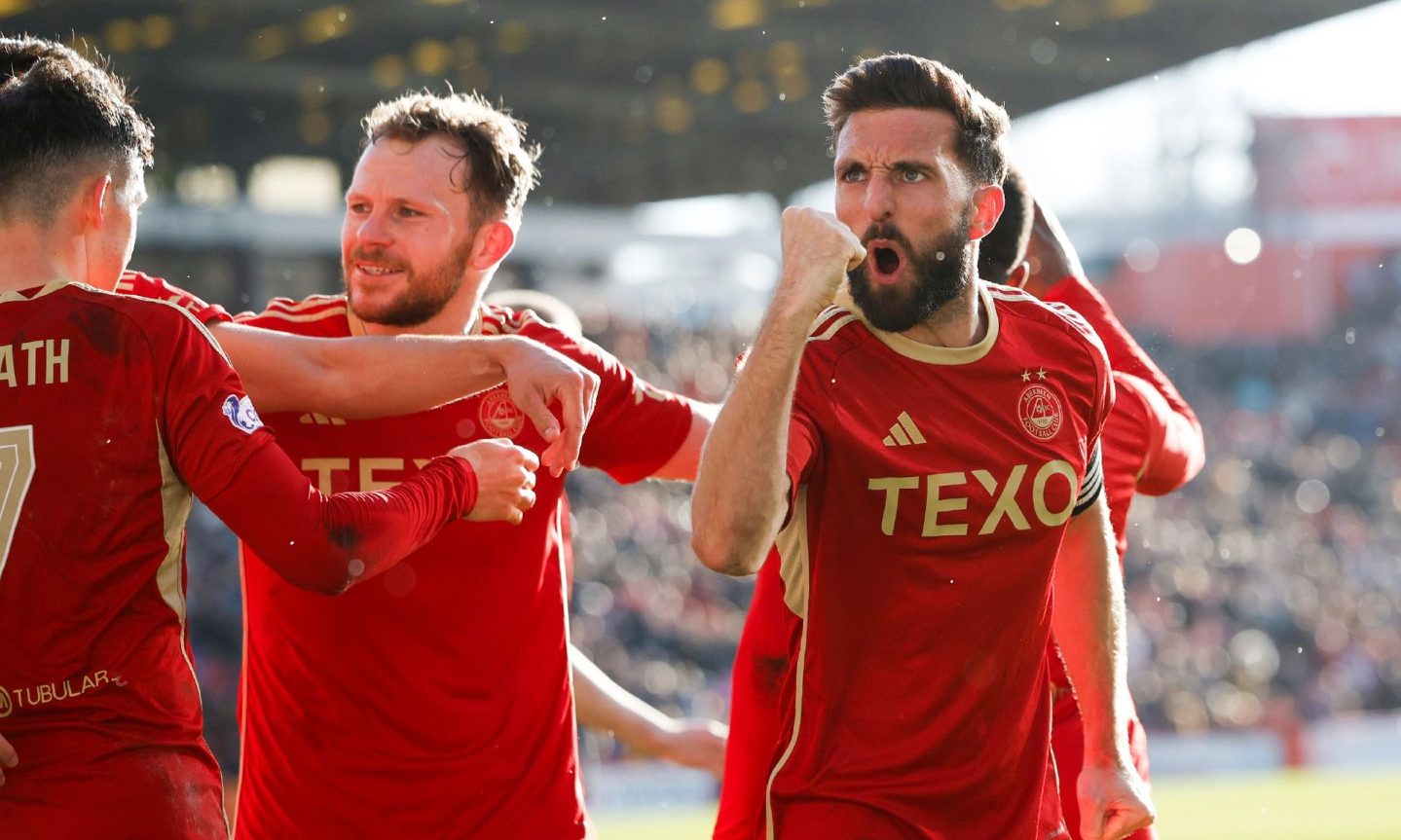 Aberdeen captain Greame Shinnie celebrates going 2-1 up against Ross County.