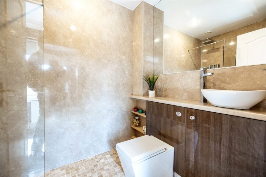 Earth-tone bathroom in the renovated townhouse in Aberdeen.