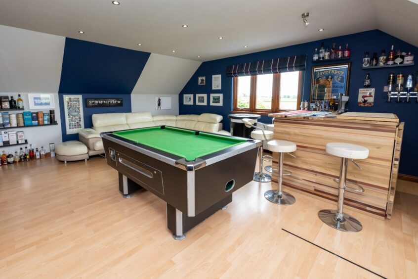 Bar and game room with pool table in the Auchnagatt property