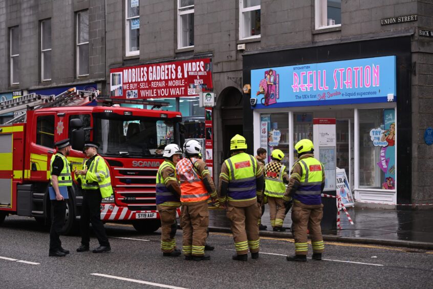 Firefighters pictured outside the Refill Station shop in Aberdeen.