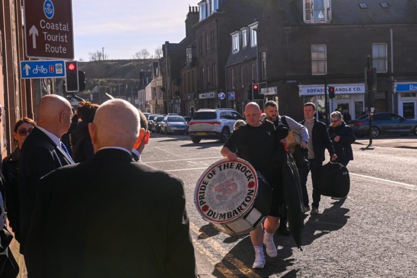 Pride of the Rock Dumbarton band members arrive at Town Hall