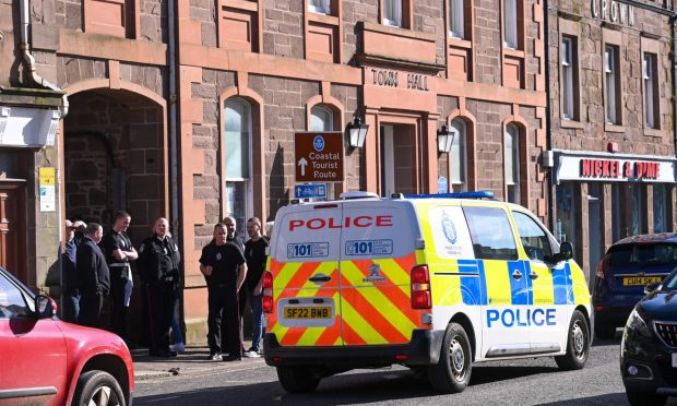Police van and Orange Order members outside Stonehaven Town Hall