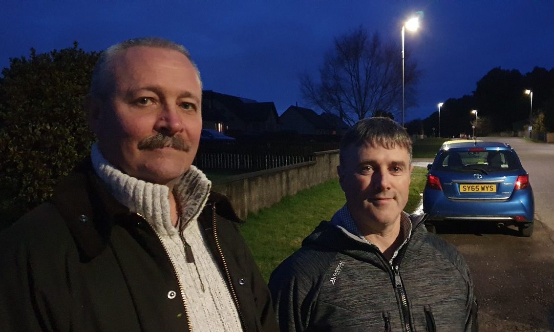 Colin McCarthy and Andrew Kelly in Thomshill next to main road. 