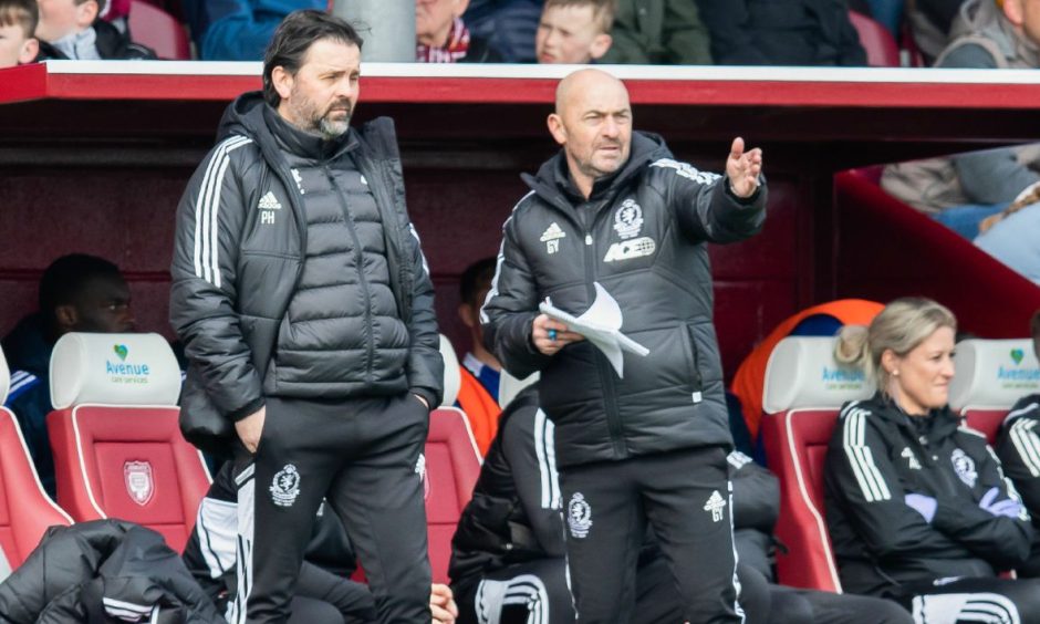 Cove Rangers manager Paul Hartley, left, and his former assistant Gordon Young, right, in the dugout during a league match.