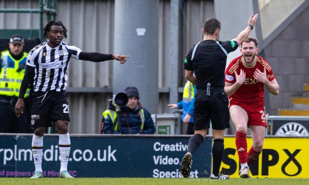 Referee Nick Walsh awards a penalty to St Mirren after a foul from Aberdeen's Nicky Devlin. Image: SNS.