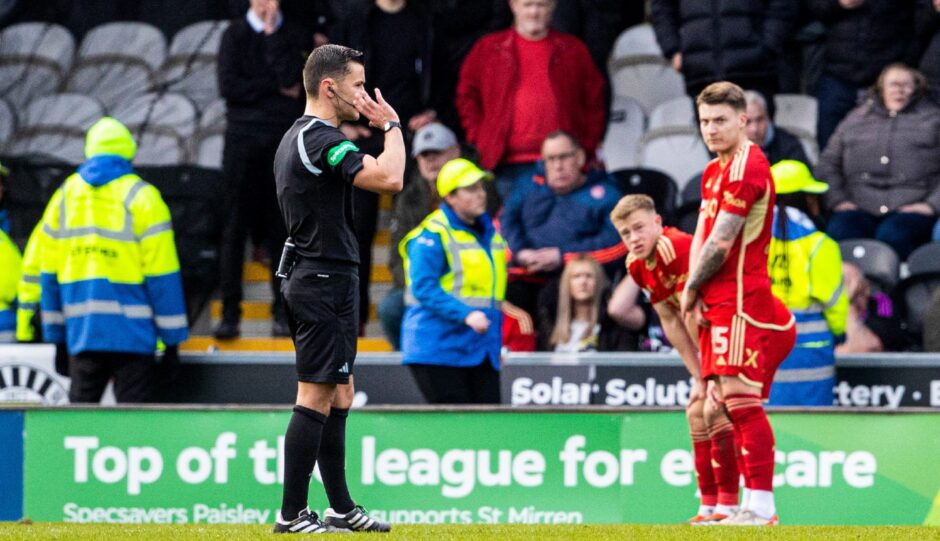 Referee Nick Walsh awards a penalty to St Mirren after a foul from Aberdeen's Nicky Devlin. Image: SNS.