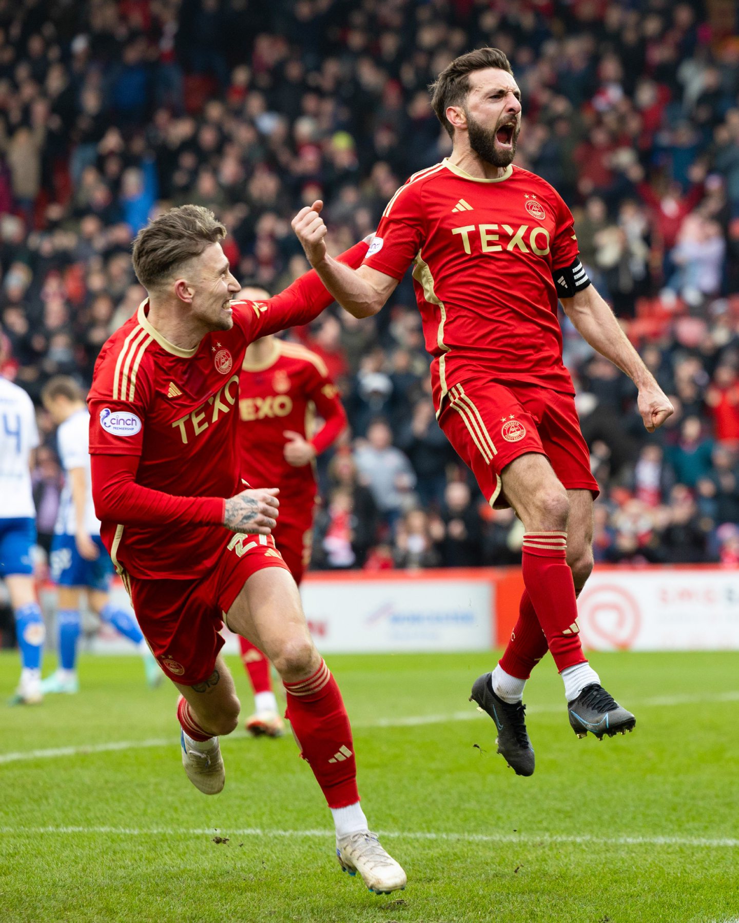 Aberdeen's Graeme Shinnie (R) celebrates scoring to make it 2-0 against Kilmarnock with teammate Angus MacDonald (L) during a Scottish Cup quarter-final. Image: SNS 