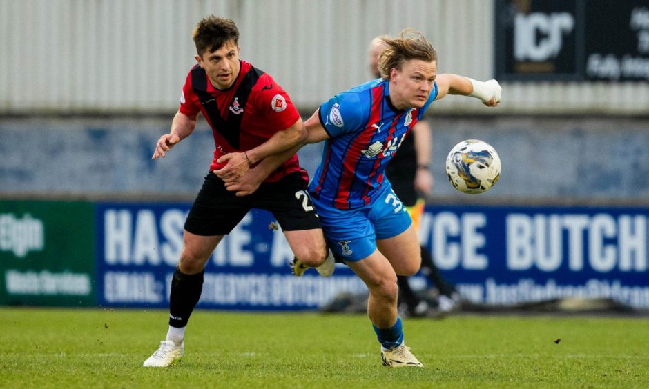 IC striker Alex Samuel tussles with Airdrie's Charlie Telfer.