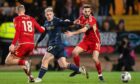 Dundee's Luke McCowan and Aberdeen's Killian Phillips and Graeme Shinnie during the sides' Premiership meeting in March. Image: SNS.