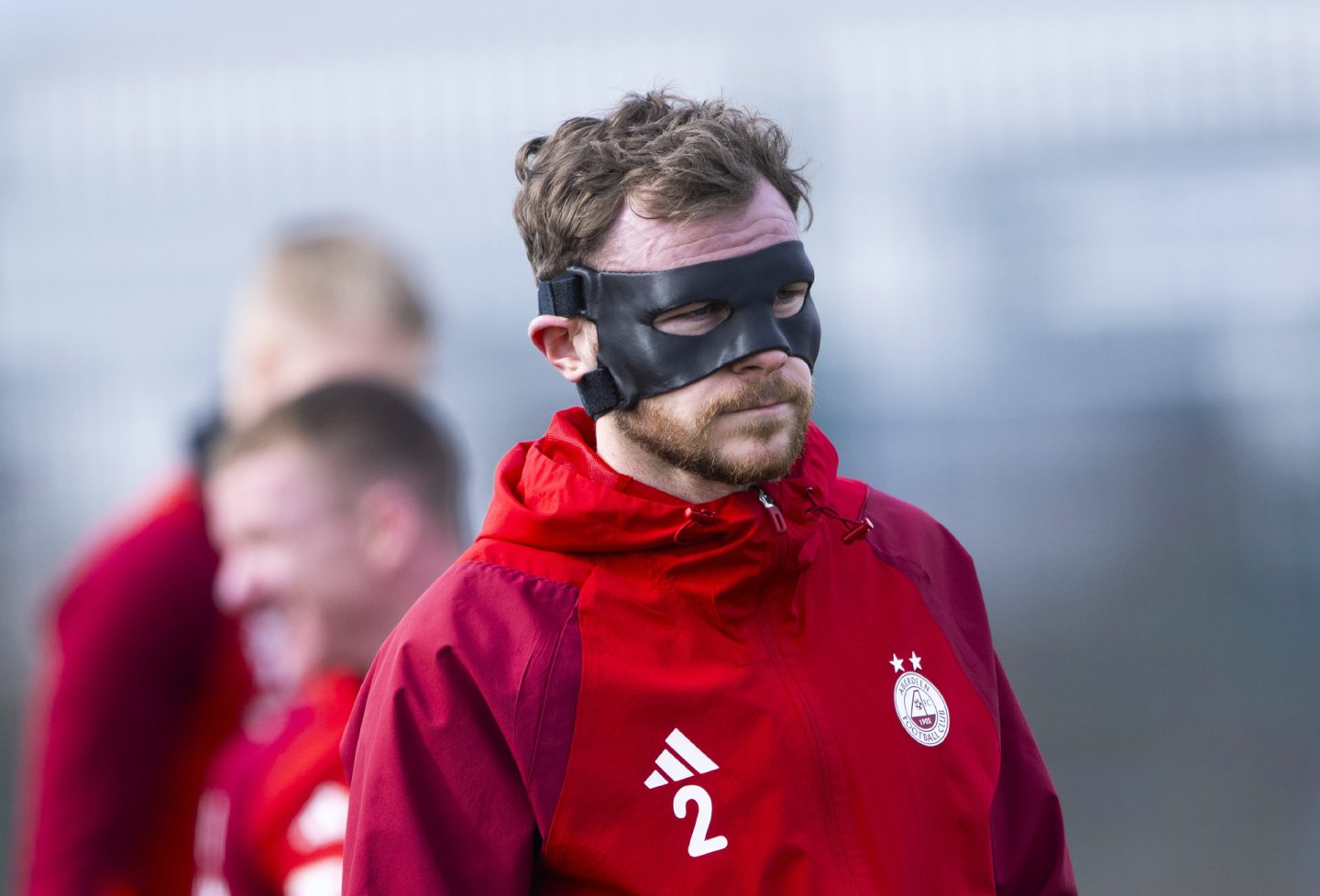 Nicky Devlin wears a protective face mask during an Aberdeen training session at Cormack Park. Image: SNS 