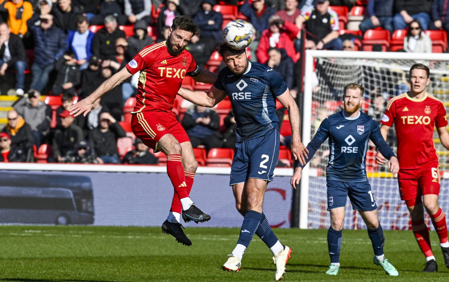Aberdeen's Graeme Shinnie and Ross County's Connor Randall in action at Pittodrie.