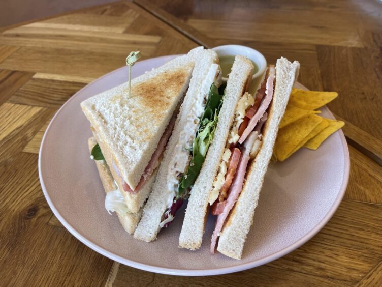 Sweet Mumma's Kitchen's club sandwich served with a soup shot and tortilla chips.