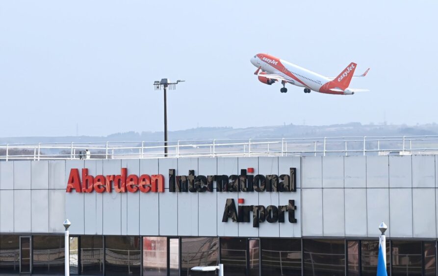 easyJet flight taking off from Aberdeen International Airport.