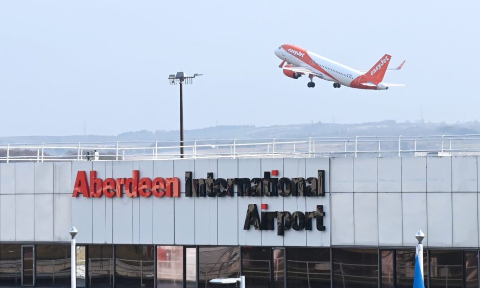 easyJet flight taking off from Aberdeen International Airport.