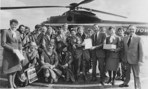 1986: Bristow Helicopters general manager Scotland Capt. Alan MacGregor presents Neil Farnham, Lincolnshire, with a certificate to commemorate the Bristow AS Tiger helicopter's 100,000 flight hours after the 'copter's return from Conoco's Hutton TLP platform. Also pictured are stewardesses Jenny Morrison, right, Inverurie, and Jackie Robertson, Aberdeen. Image: DC Thomson