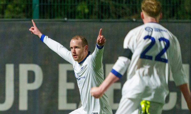 Garry Wood, left, celebrates scoring for Banks o' Dee against Turriff United. Pictures by Jasperimage.