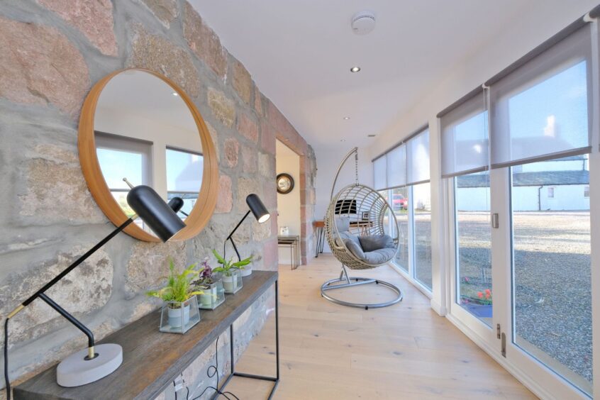 Bright space with floor-to-ceiling windows inside the Stonehaven home.