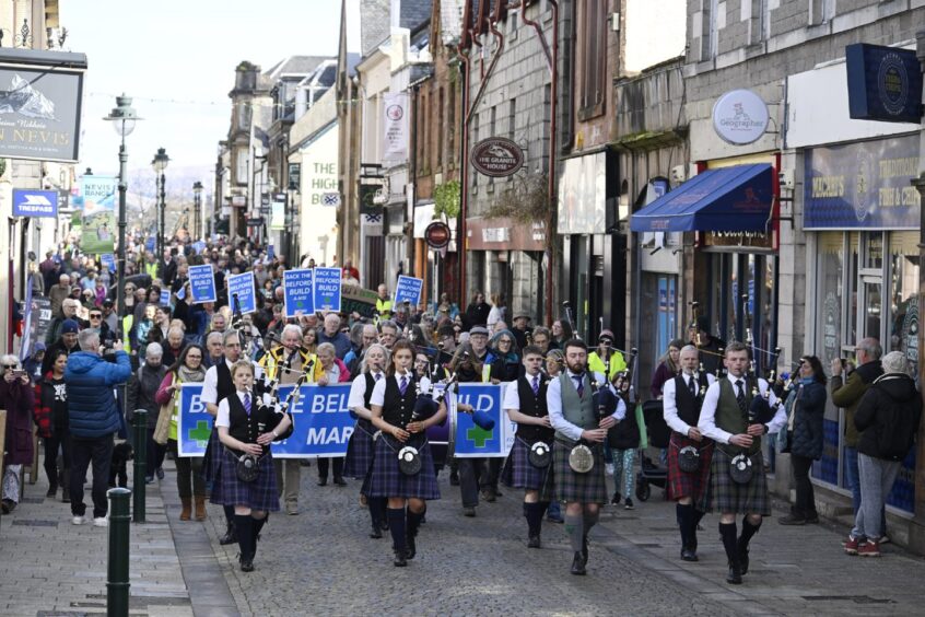 The crowd marched through the streets of Fort William concerned about the lack of funding for the Belford Hospital project. 