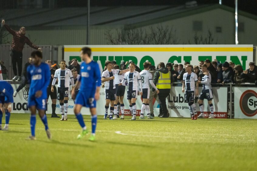 Falkirk celebrate scoring their winning goal against Cove Rangers in a League One match at Balmoral Stadium.
