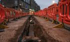 A trench is dug up on Holburn street in Aberdeen as roadworks begin.