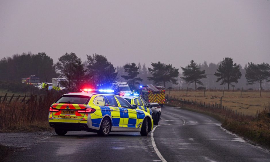 Police at site of car crash on the A947 south of Whiterashes.
