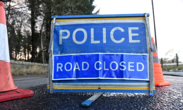 Blue police road closure sign.