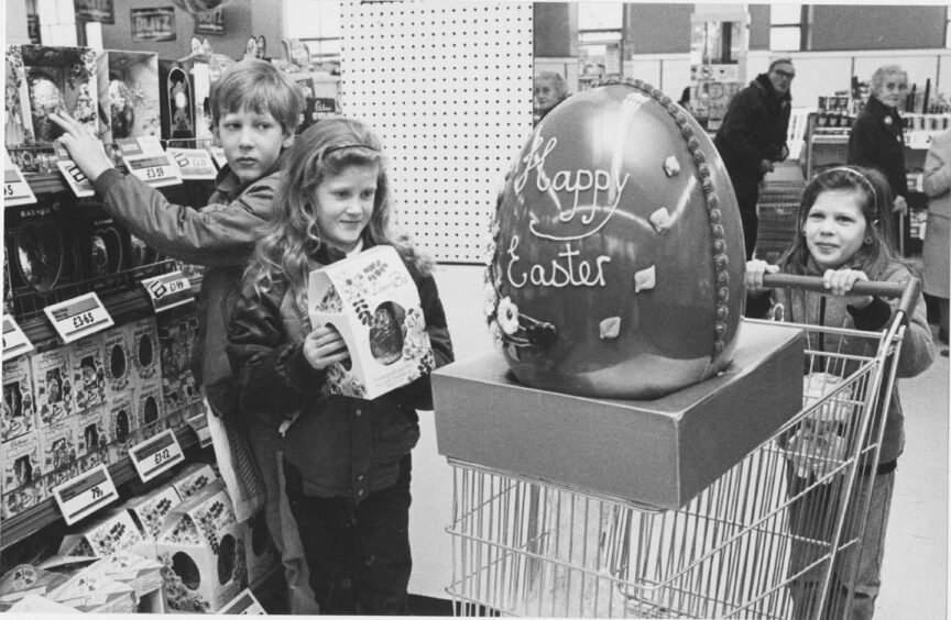 Children in a shop with a gaint easter egg