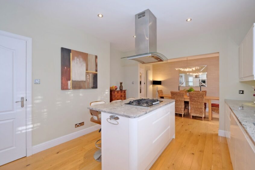 Bright kitchen in the Aberdeen property featuring an island. 