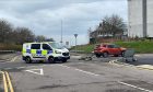 Police van, bike and car at scene of crash