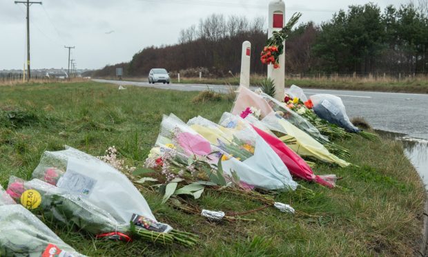 Floral tributes left at the scene of the accident have been moved to a safer spot. Image: Jason Hedges/DC Thomson