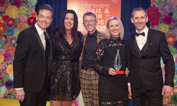 Laings director Claire McKay, second from the right, with TV star Stephen Mulhern, left, and other members of Laings' award-winning team.