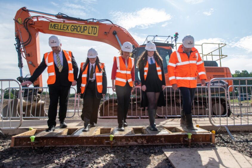 Scottish Government minister Jenny Gilruth, third from the left, and Robertson Group CEO Elliot Robertson, far right, were among those at an event to mark the start of work on the new East End Community Campus in Dundee last year.