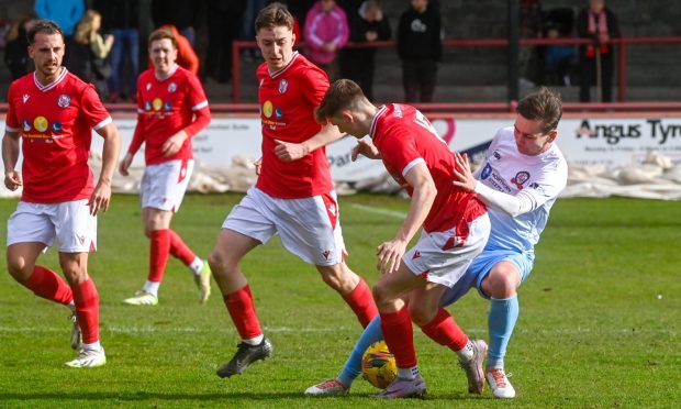 CR0047447, Callum Law, Brechin.
Highland League - Brechin City v Turriff United.

Turriff's Liam Strachan, right, tackles Ewan Loudon of Brechin.

Picture by Kenny Elrick/DC Thomson  23/03/24