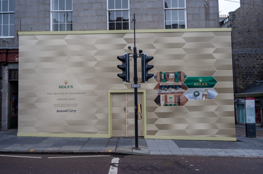 Boards advertising new Rolex showroom on Union Street