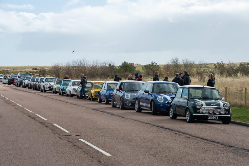 Mini's line up along the road. 