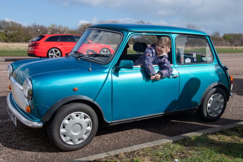 Picture of Grace Knowles, 4 in a blue mini. 