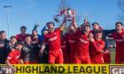 The Brora Rangers squad celebrates with the GPH Builders Merchants Highland League Cup after their victory against Fraserburgh. Pictures by Kath Flannery/DCT Media.