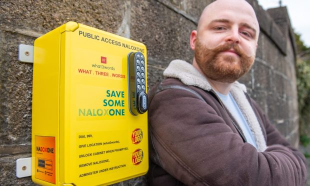 The yellow box that will soon be hitting Aberdeen. Paramedic Kieran Whitford shows off his naloxone brainchild. Image: Kami Thomson/DC Thomson