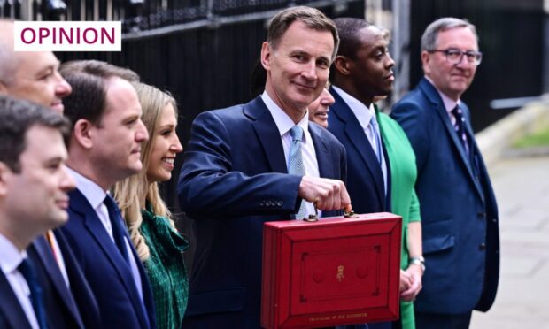 UK Chancellor Jeremy Hunt shows off his new lunchbox. Image: James Veysey/Shutterstock
