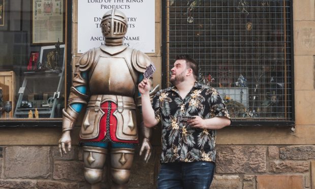 Martin Bearne in Edinburgh looking at a suit of armour.