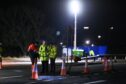 Crash investigators at the scene of the tragedy on the A90 near Tipperty. Image DC Thomson